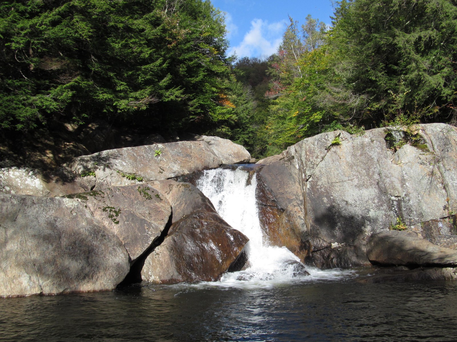 Buttermilk Falls pouring into a swimming hole near Ludlow