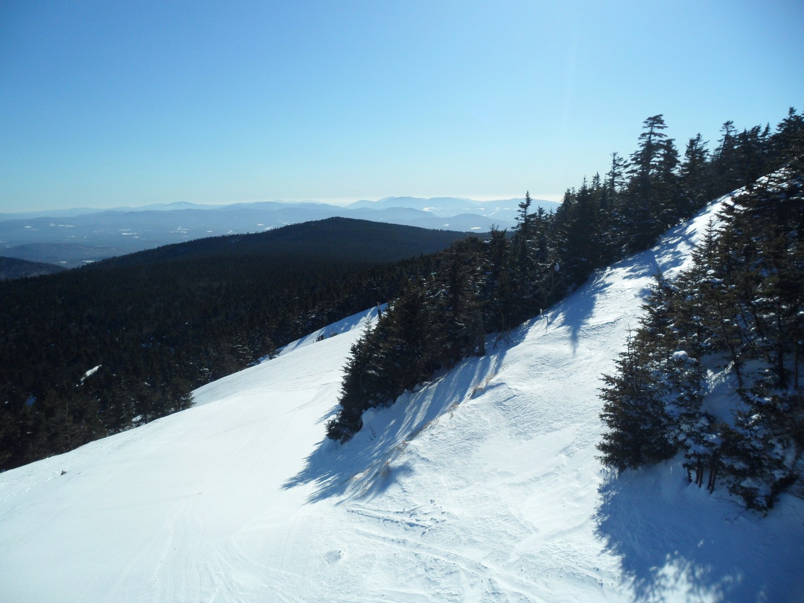 A groomed trail at Killington with Green Mountain views